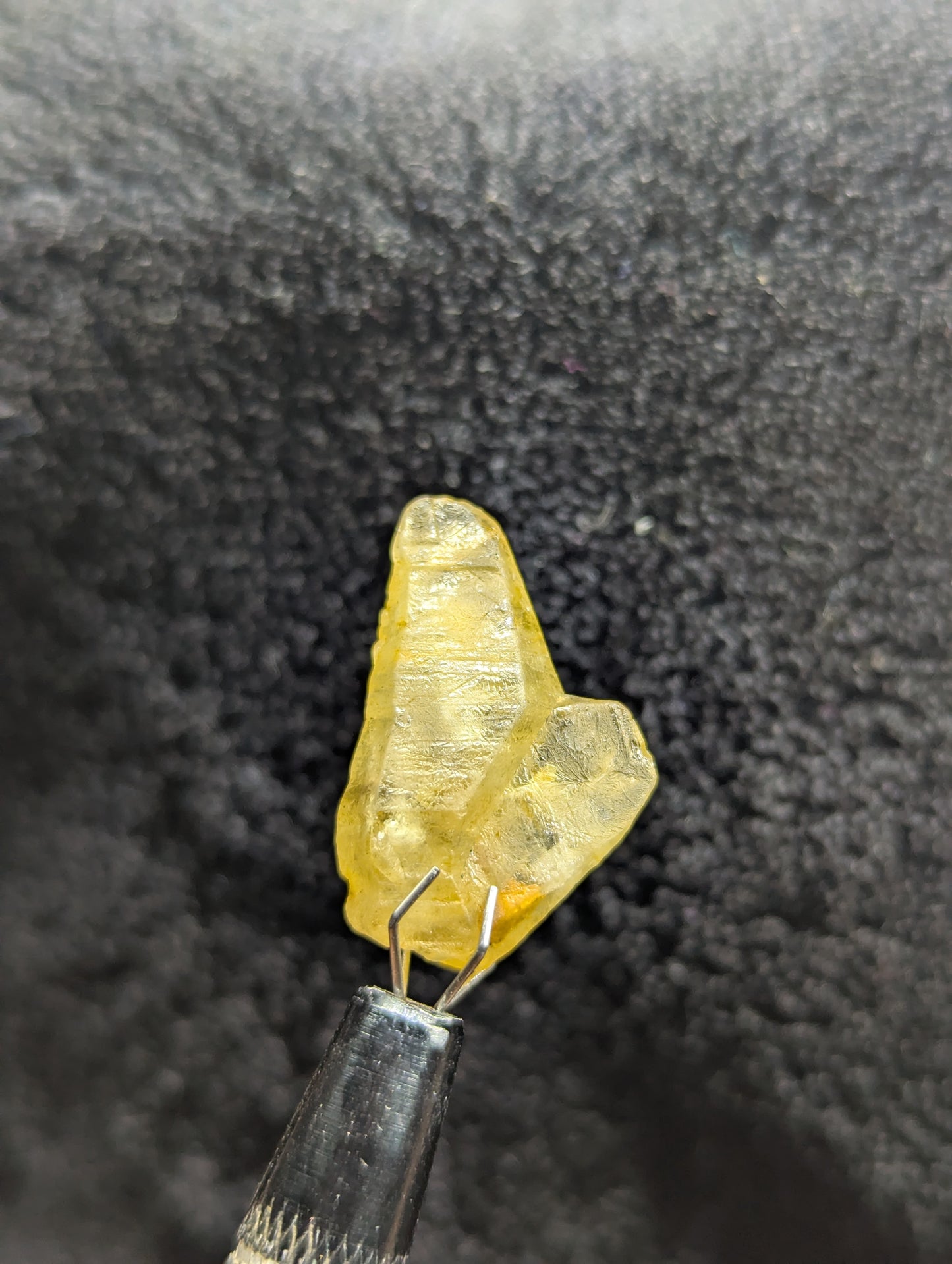 Natural twinned yellow sapphire crystal, 19.4ct with a unique raw structure and warm golden color. A perfect collectible or centerpiece for custom jewelry.